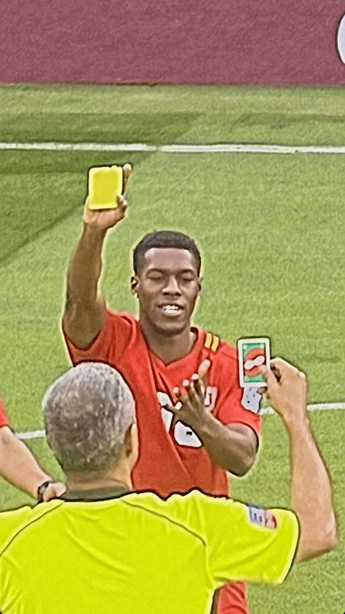 A person in a casual outfit is being photographed outdoors while holding up a yellow card.