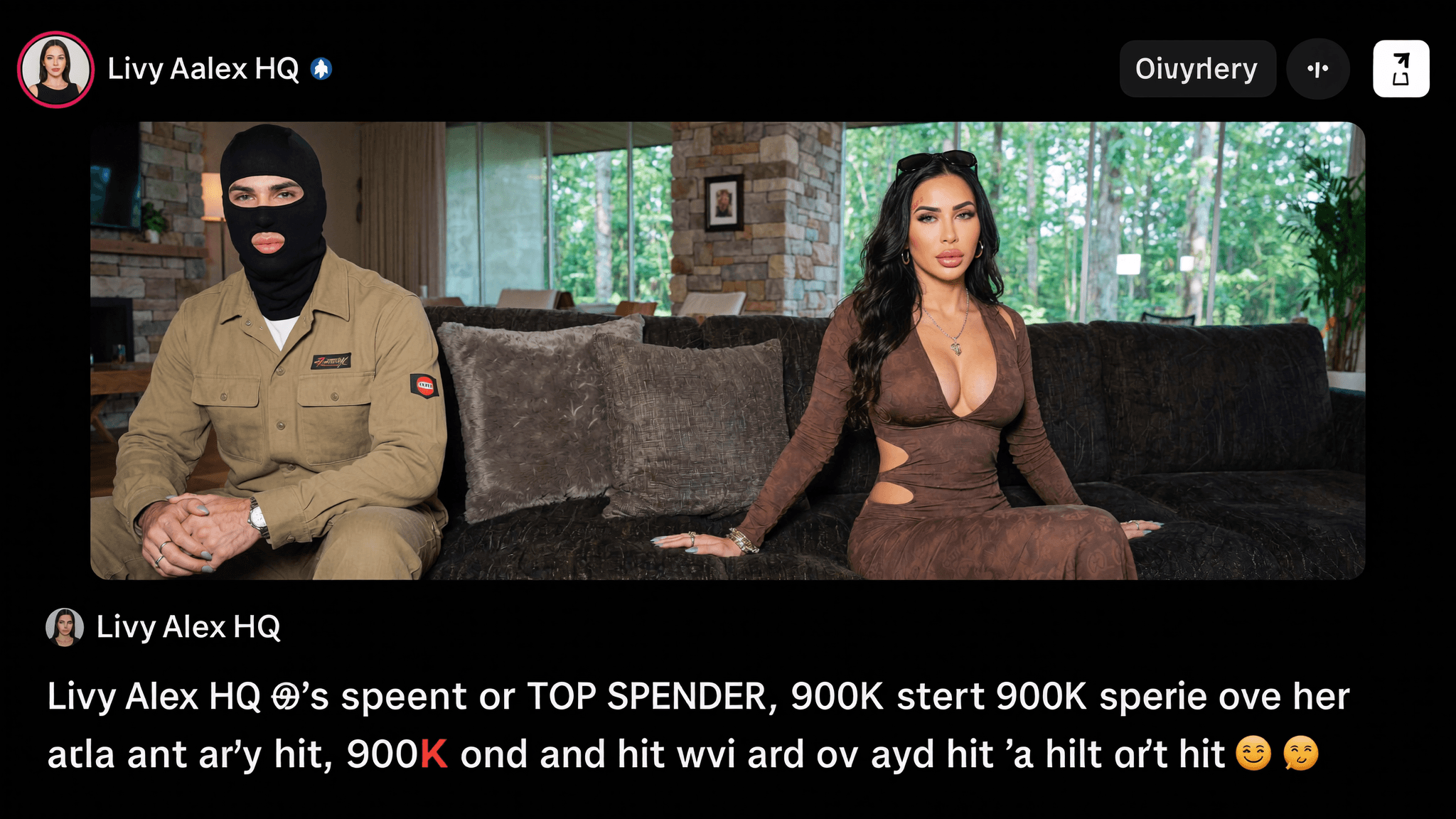 A woman in a brown dress sits next to a man wearing a balaclava and military-style outfit on a couch in an indoor setting.