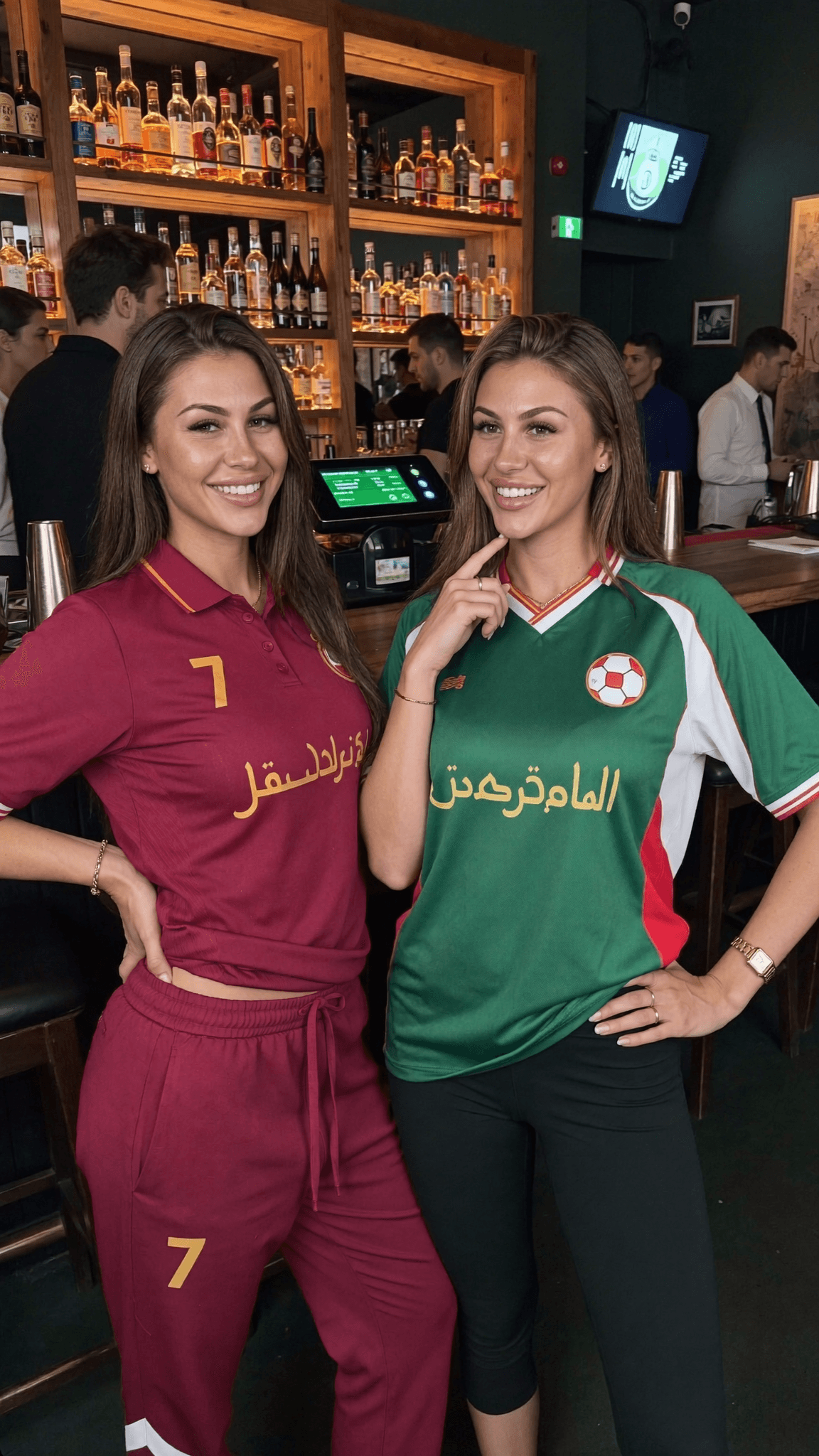 Two women in athletic wear pose together at a club.