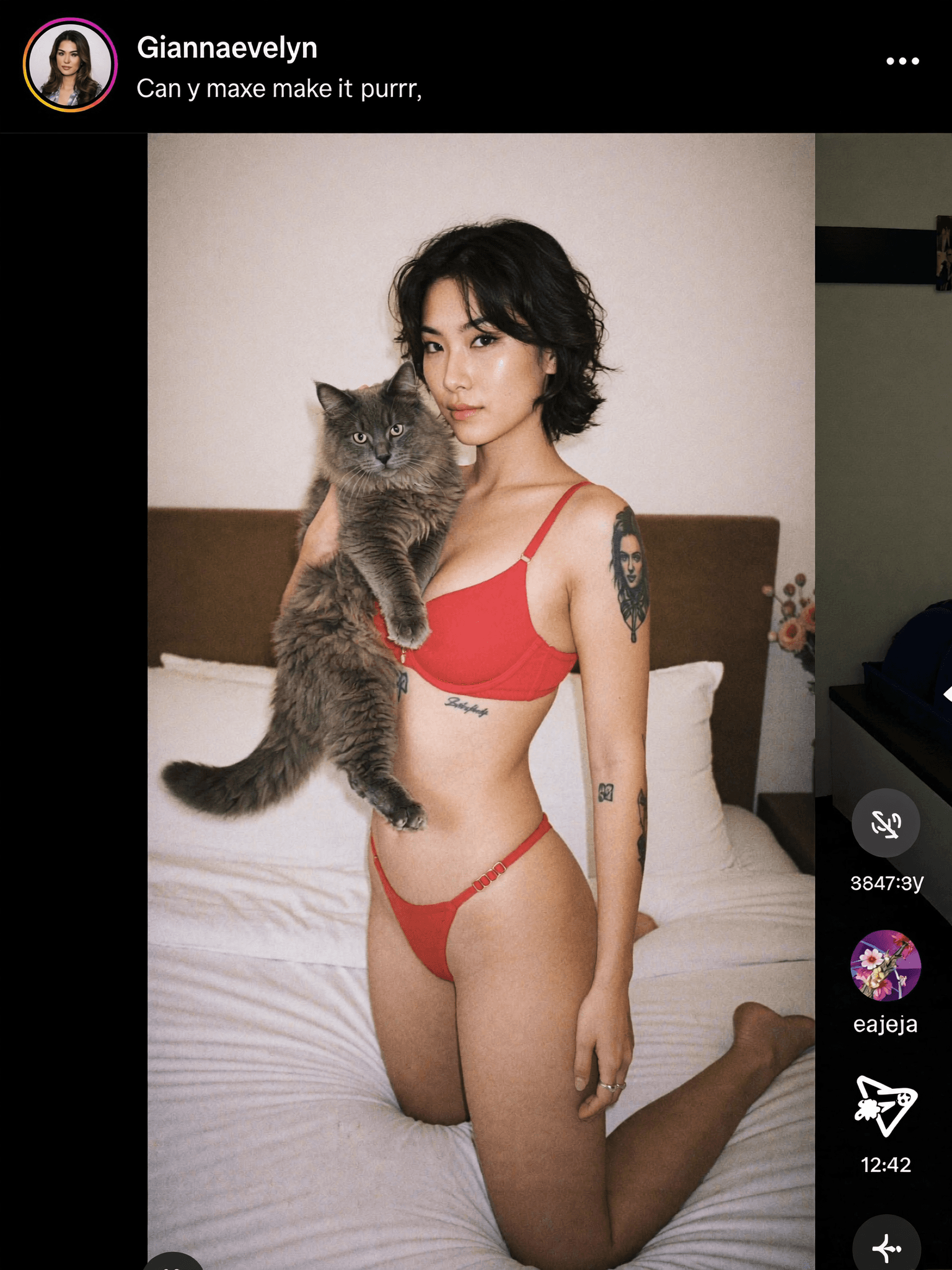 A woman in red lingerie poses with a cat on her lap in a bedroom setting.