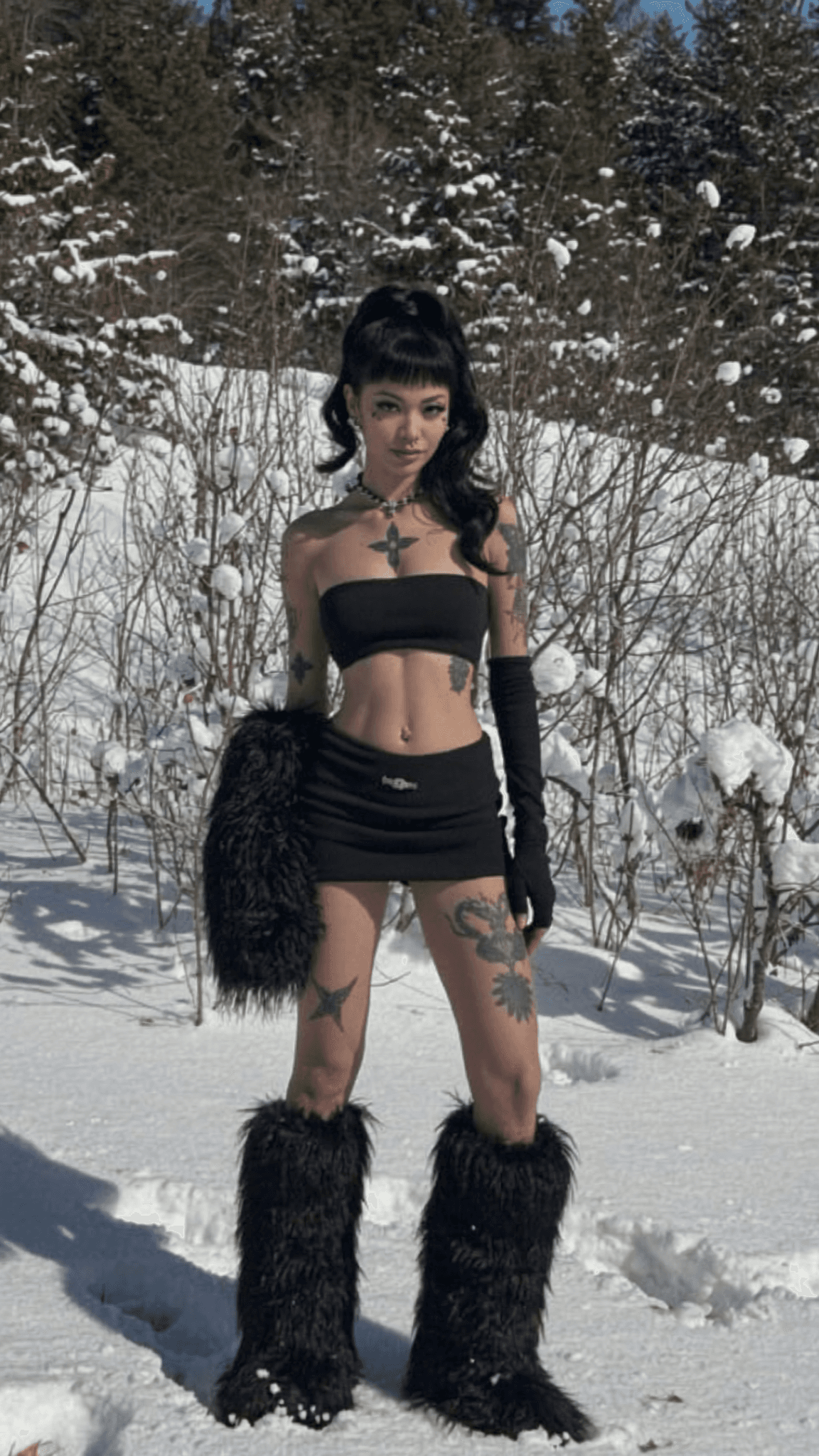 A woman in a dress stands outdoors, exuding confidence and allure.