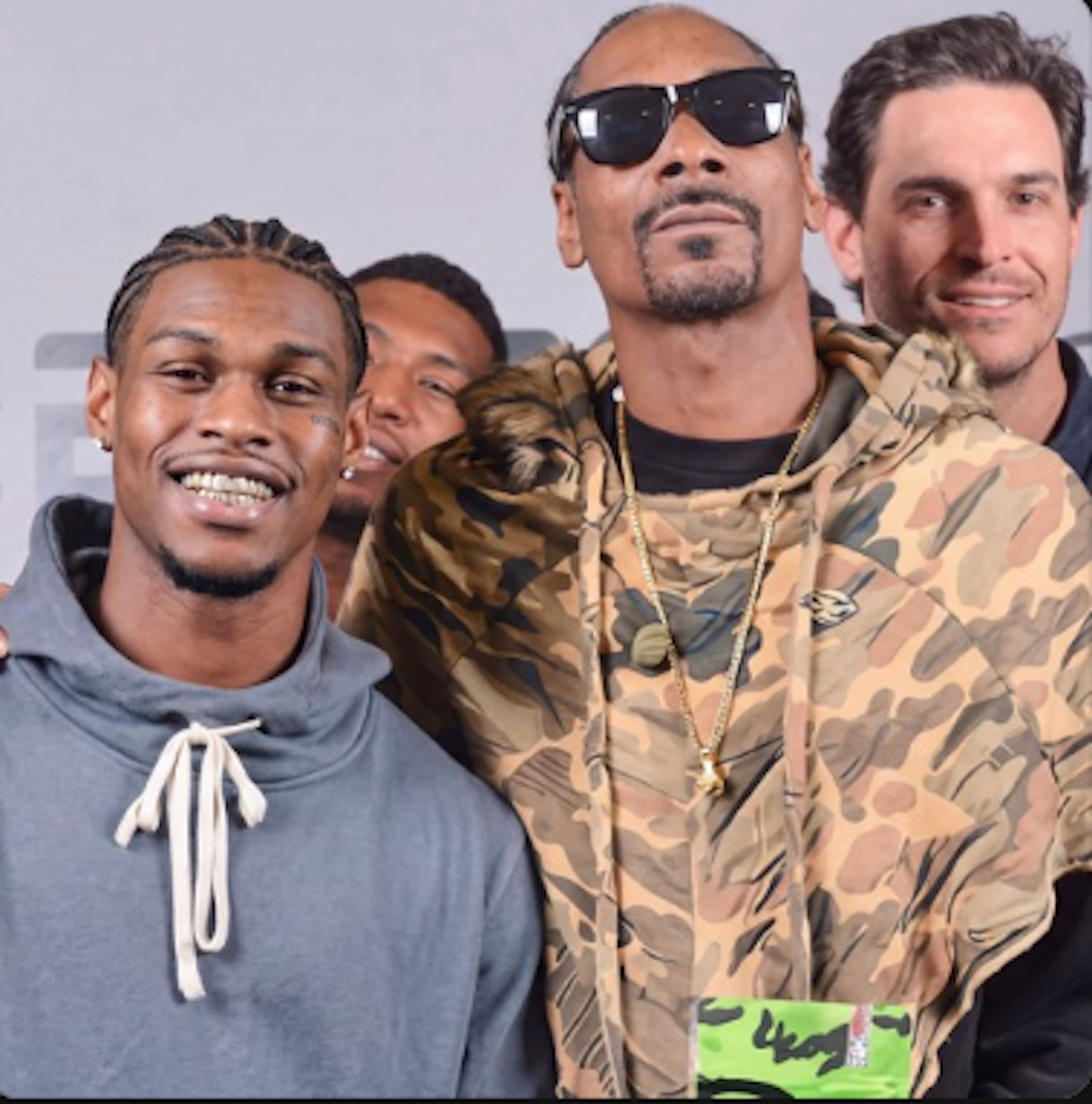 Documented photo with Snoop Dogg — the Broadus / Code Black lane.